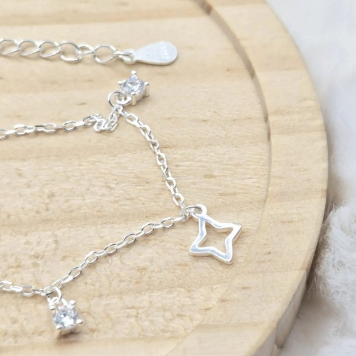 Pulseira-de-prata-925-com-pingente-ponto-de-luz-e-estrela-4-pontas-ex2