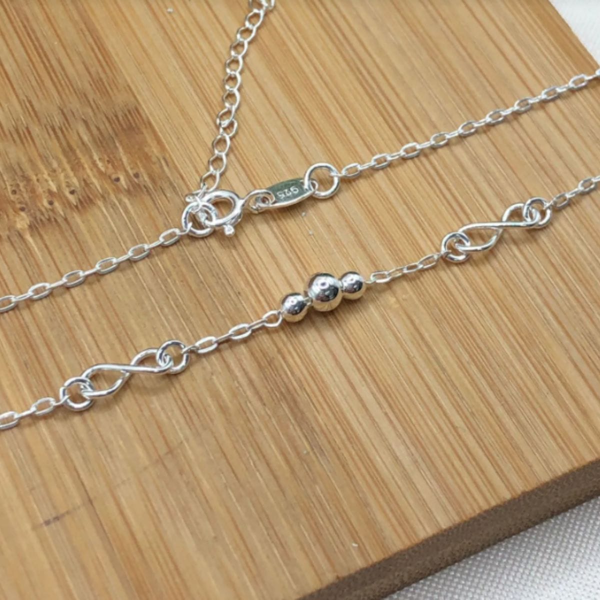 Tornozeleira de prata 925 elo cadeado com pingente 3 bolinhas e infinito - Imagem 2